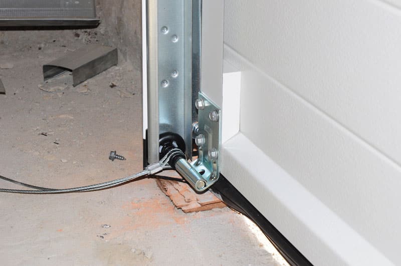 Garage door cable and track hardware during service