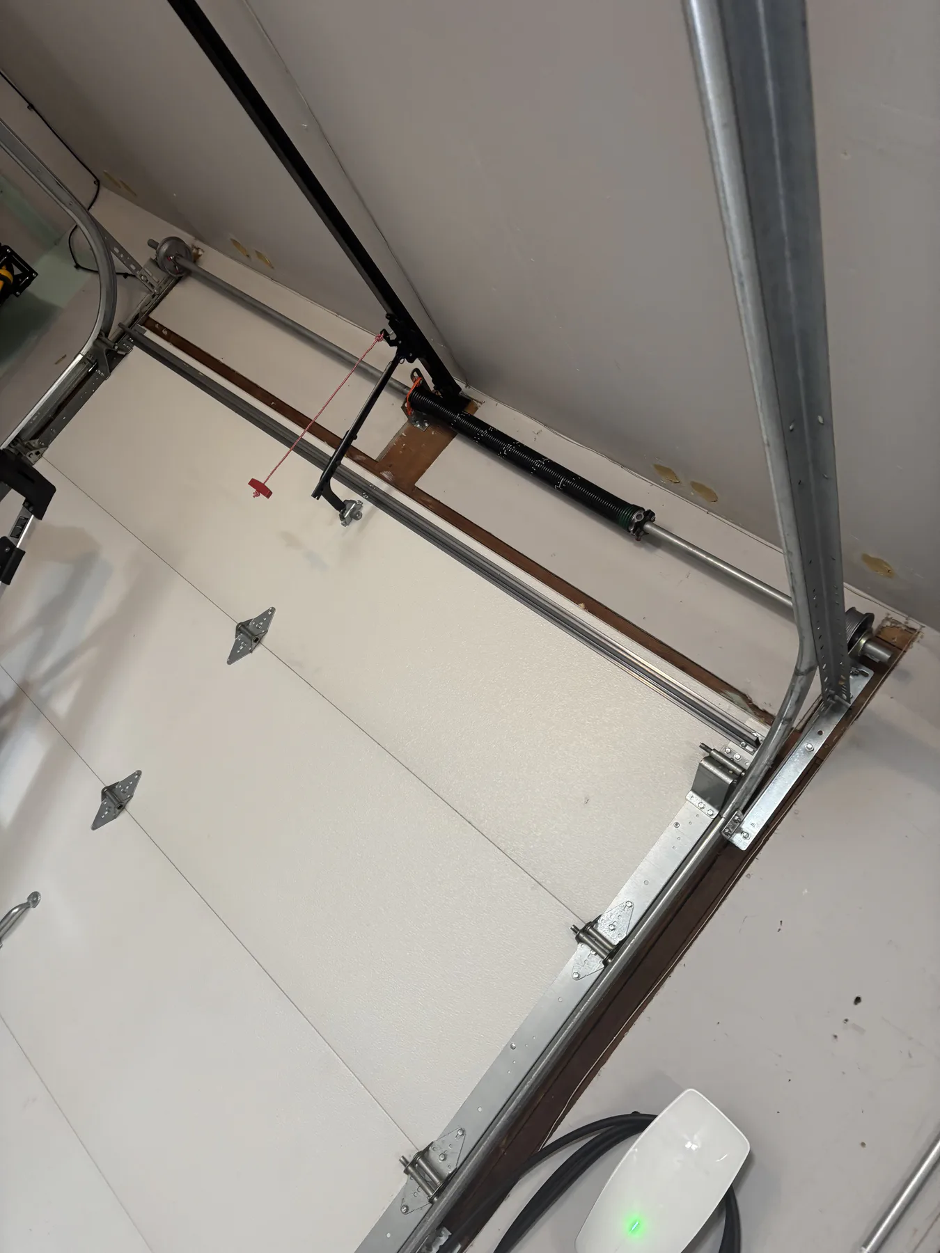 New torsion spring system installed on a Monument garage door in December 2025
